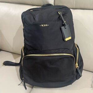Designer Tumi Black and Gold Backpack for Business Travel
